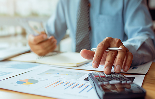 Close up Business Hand Using are calculating on calculator inves